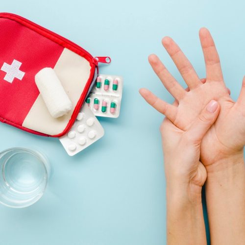 close-up-hands-with-medication_23-2148504640